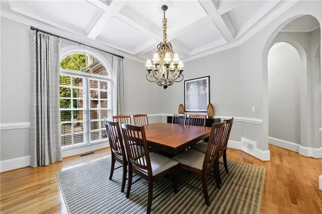 a view of entryway with wooden floor and a front door