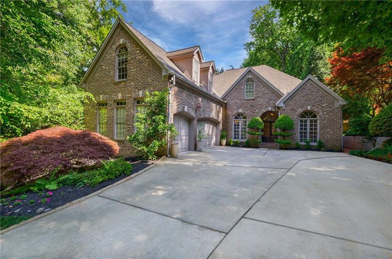 1255 Beech Haven Road Northeast Atlanta, GA 30324 - Photo 86 of 87 a front view of a house with a yard and garage