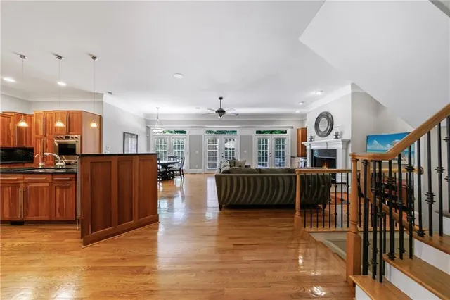 a kitchen with stainless steel appliances granite countertop a sink and a stove