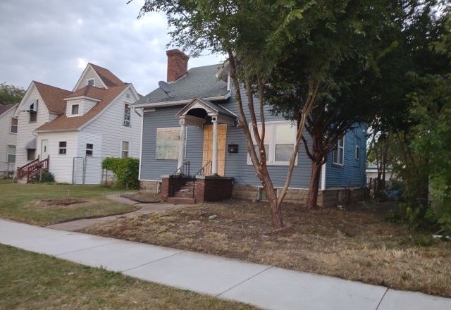 1326 South 5th Street Rockford, IL 61104 - Photo 3 of 3 a front view of a house with a yard