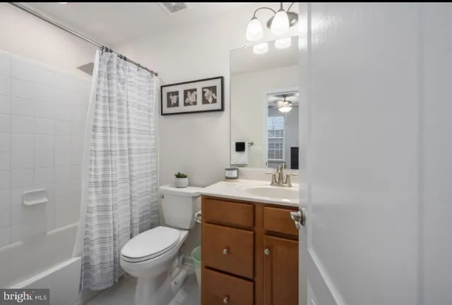 a bathroom with a double vanity sink mirror and shower