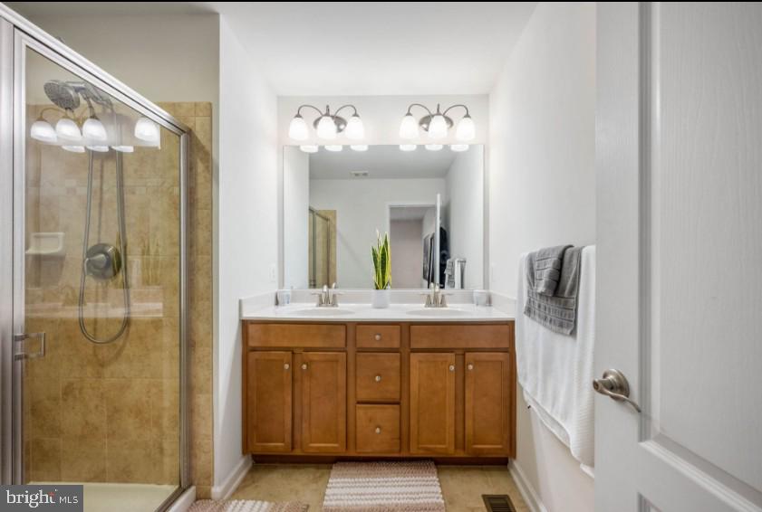 111 Tree Line Drive Fredericksburg, VA 22405 - Photo 18 of 20 a bathroom with a double vanity sink mirror and shower