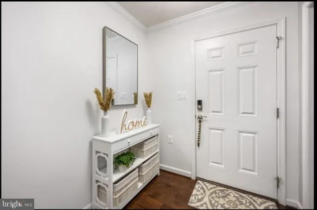 a view of an entryway with kitchen