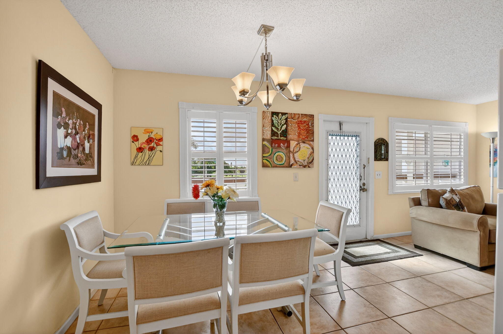 4008 Hythe A Boca Raton, FL 33434 - Photo 12 of 58 a view of a dining room with furniture a chandelier and a window