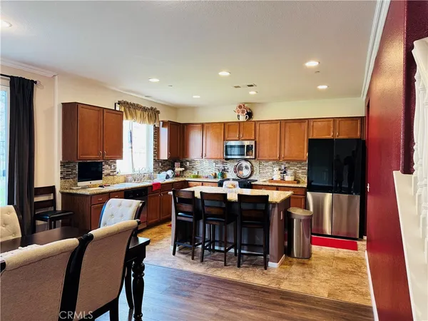 a kitchen with a sink stove top oven and microwave