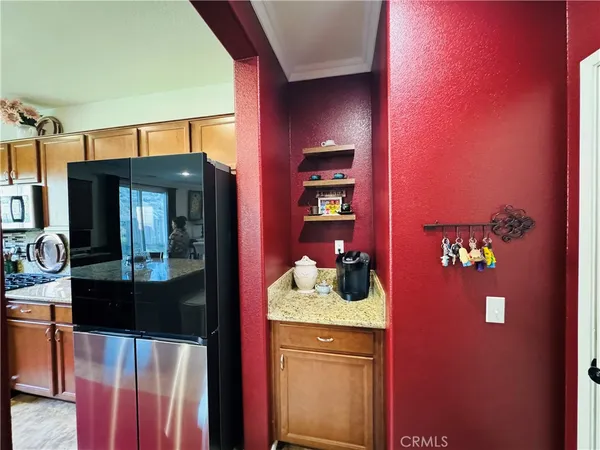 a bathroom with a sink a mirror a toilet and a window