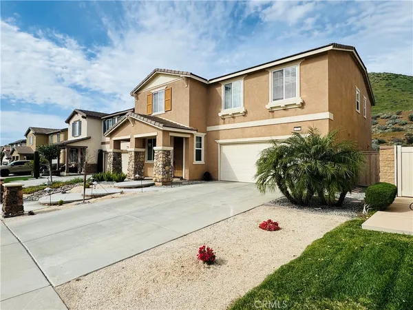 a front view of a house with yard