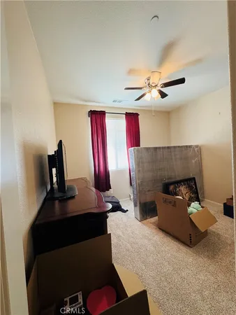 a bathroom with a sink a toilet and shower curtain
