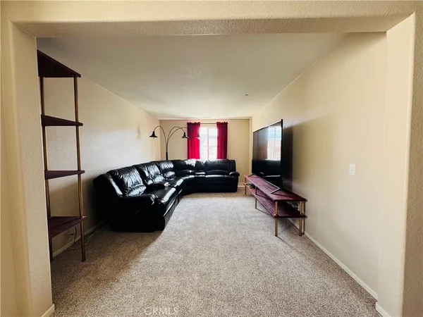 a view of livingroom with hardwood floor and a ceiling fan