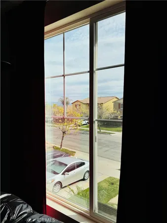a bedroom with furniture and a window