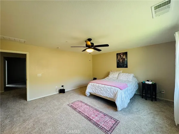 a view of a street with cars parked