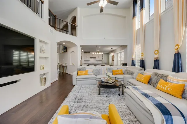 a living room with furniture fireplace and a flat screen tv