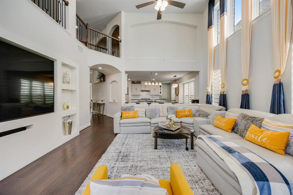 1524 Buckthorn Road Fate, TX 75087 - Photo 11 of 37 a living room with furniture fireplace and a flat screen tv