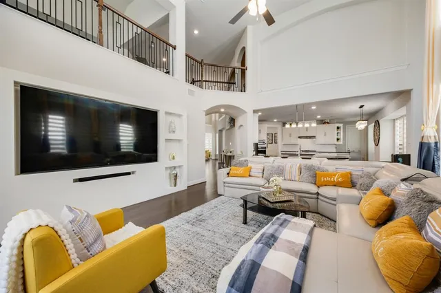 a living room with furniture fireplace and flat screen tv
