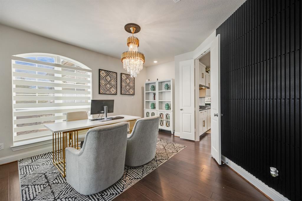 1524 Buckthorn Road Fate, TX 75087 - Photo 16 of 37 a view of a dining room with furniture window and wooden floor