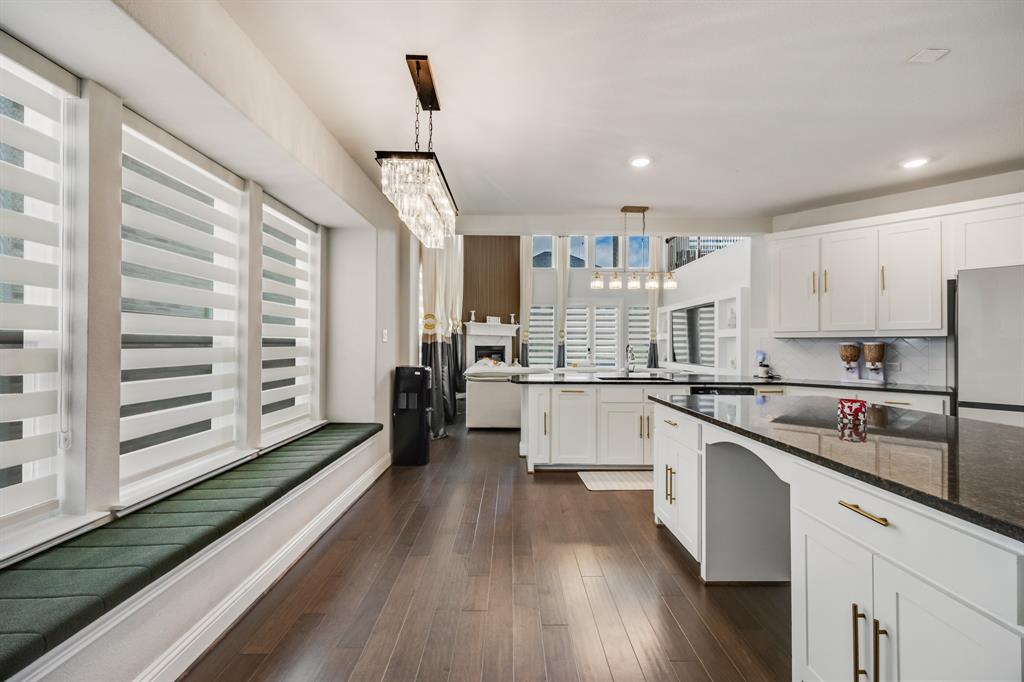 1524 Buckthorn Road Fate, TX 75087 - Photo 17 of 37 a kitchen with white cabinets and appliances