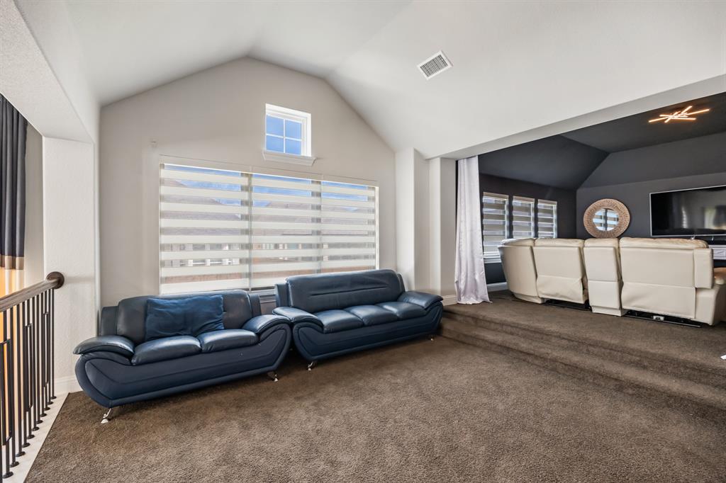 1524 Buckthorn Road Fate, TX 75087 - Photo 22 of 37 a living room with furniture and a window