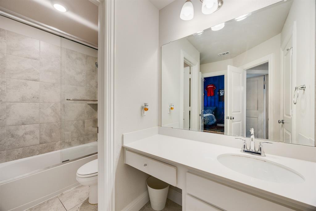 1524 Buckthorn Road Fate, TX 75087 - Photo 26 of 37 a bathroom with a sink a toilet and shower