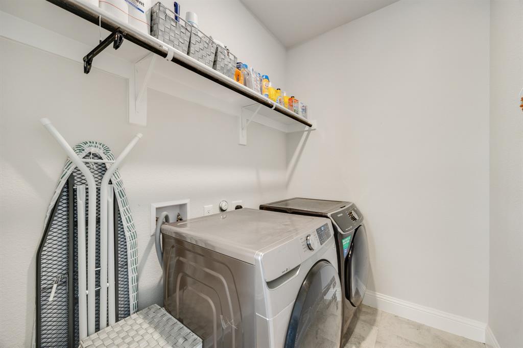 1524 Buckthorn Road Fate, TX 75087 - Photo 29 of 37 a utility room with dryer and washer