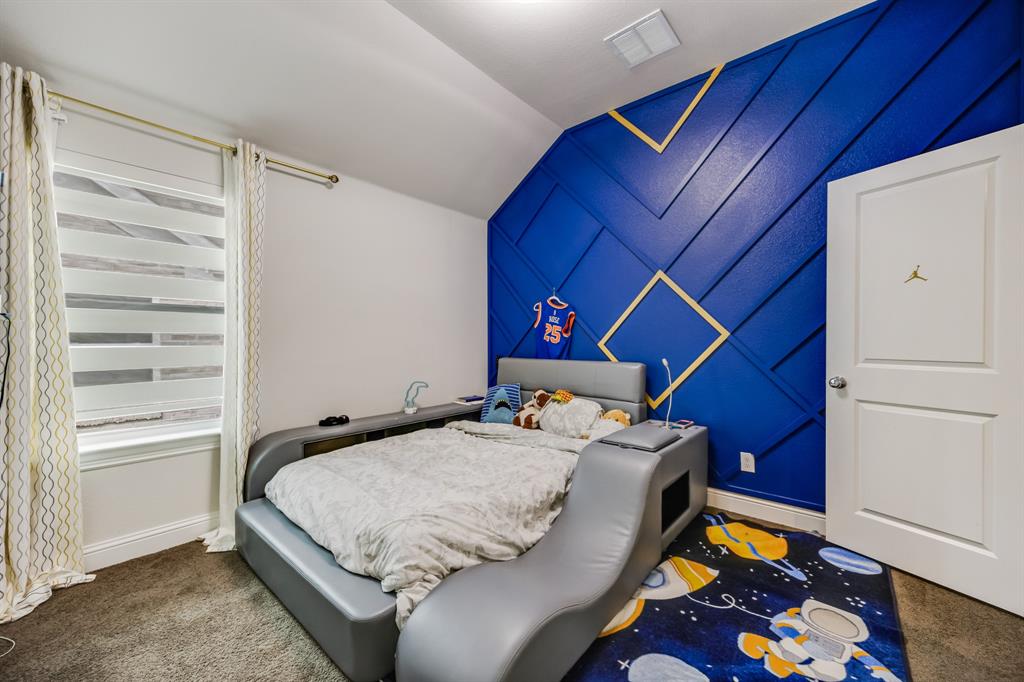 1524 Buckthorn Road Fate, TX 75087 - Photo 31 of 37 a bedroom with a bed and a dresser