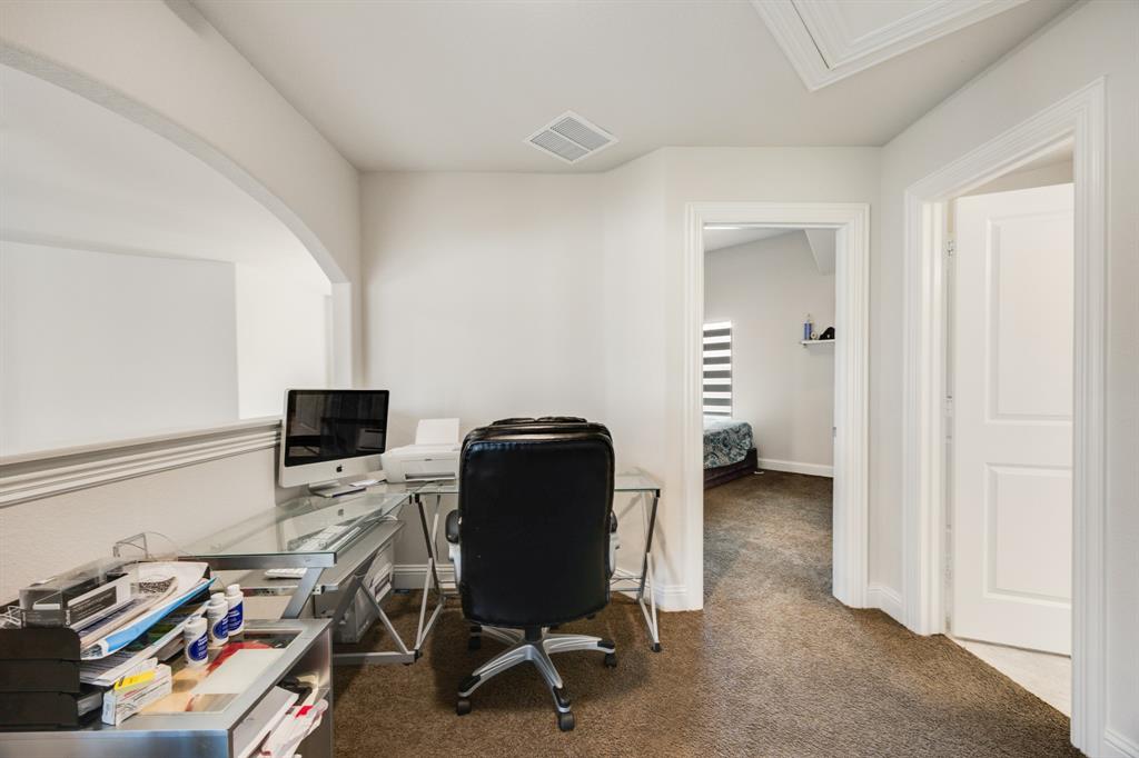 1524 Buckthorn Road Fate, TX 75087 - Photo 32 of 37 a view of a workspace with furniture and a window