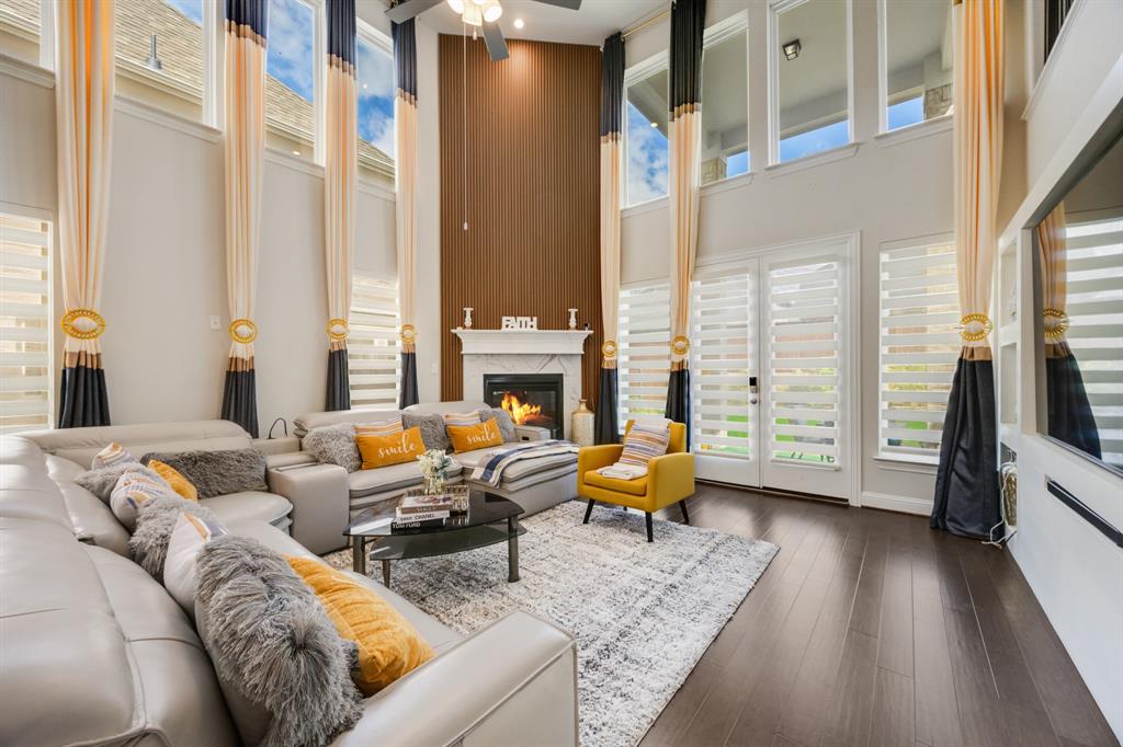 1524 Buckthorn Road Fate, TX 75087 - Photo 9 of 37 a living room with furniture and a fireplace
