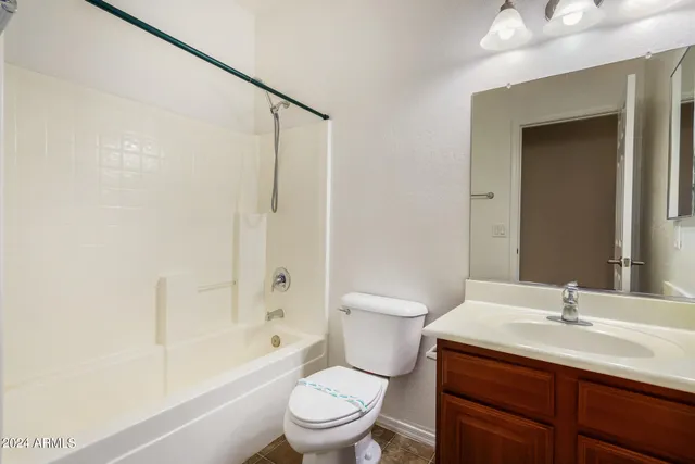 a bathroom with a sink toilet tub and shower