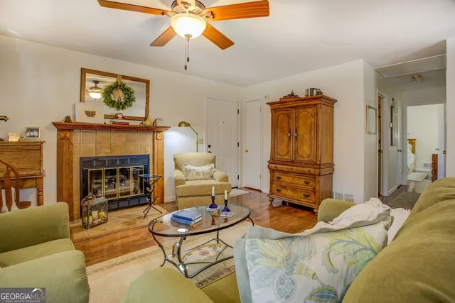 a living room with furniture a couch and chandelier