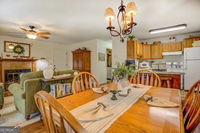 a kitchen with stainless steel appliances granite countertop a sink a stove and cabinets