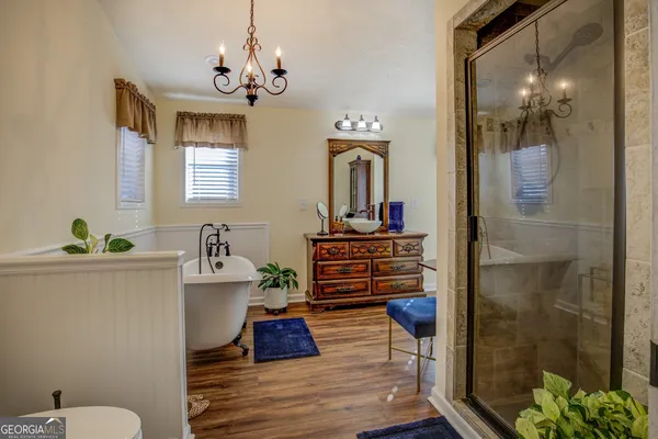 a backyard of a house with barbeque oven table and chairs