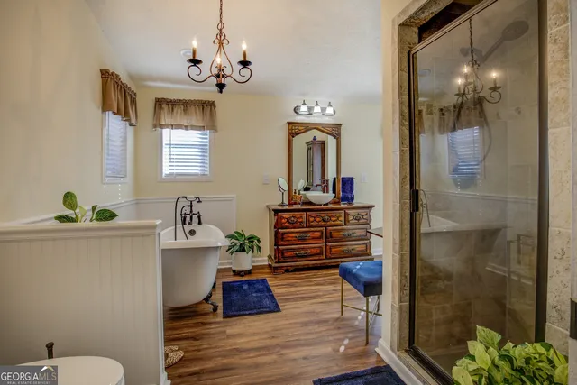 a backyard of a house with barbeque oven table and chairs