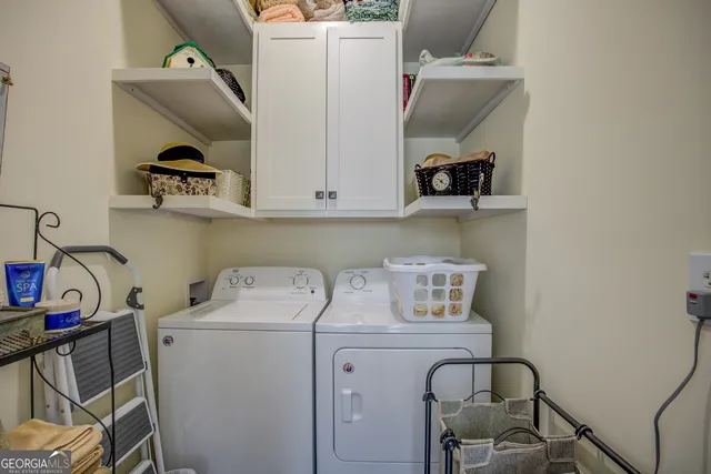 a front view of a house with a yard covered with snow