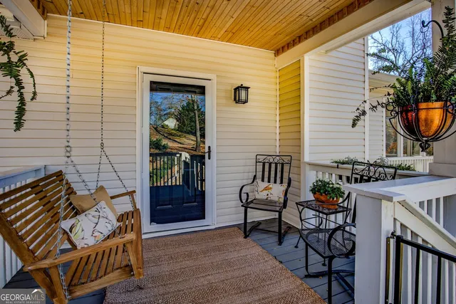 a view of a house with snow on the side of the road