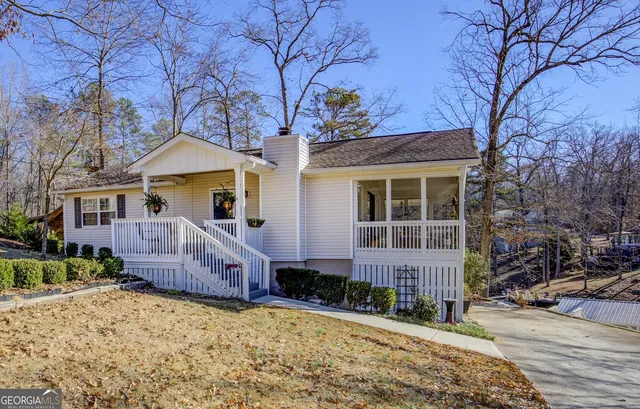 a aerial view of a house with a yard