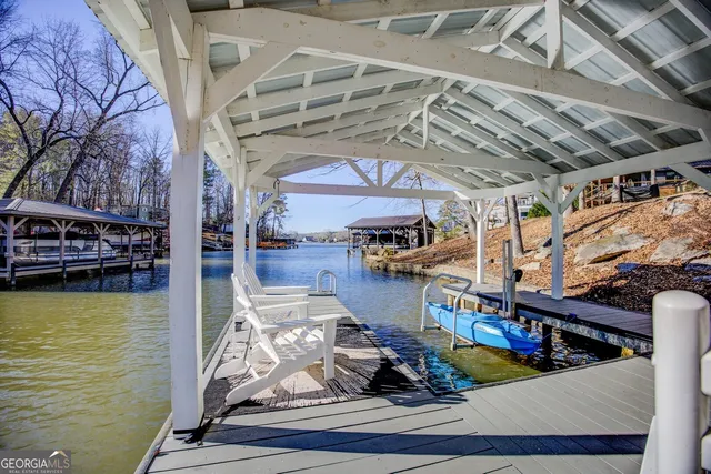 an aerial view of a houses with ocean view