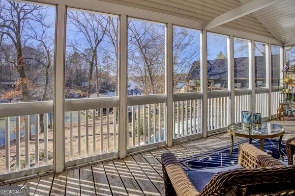 a view of a living room and wooden floor
