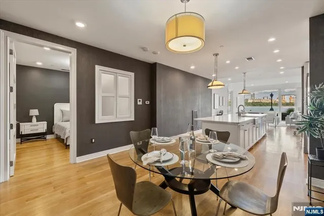 a view of a dining room with furniture and wooden floor