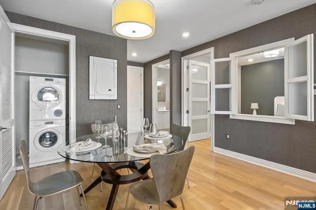 a bedroom with a bed and glass window