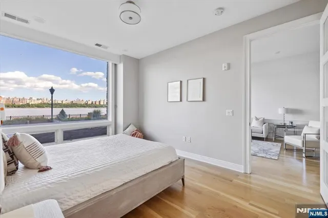 a bedroom with a large bed and a closet