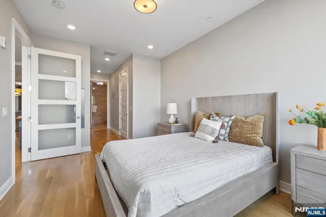 a view of an empty walk in closet and living room