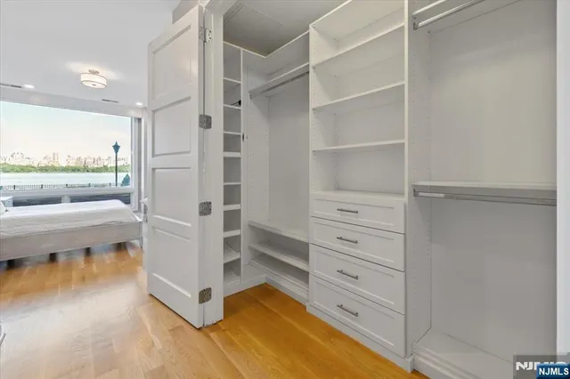 a view of living room and bedroom with furniture