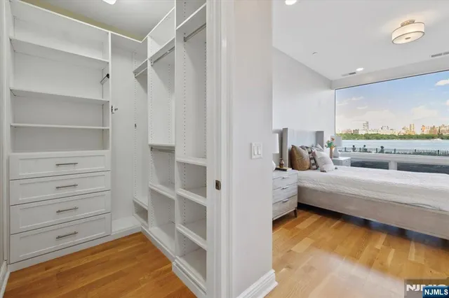 a bedroom with a bed and a table