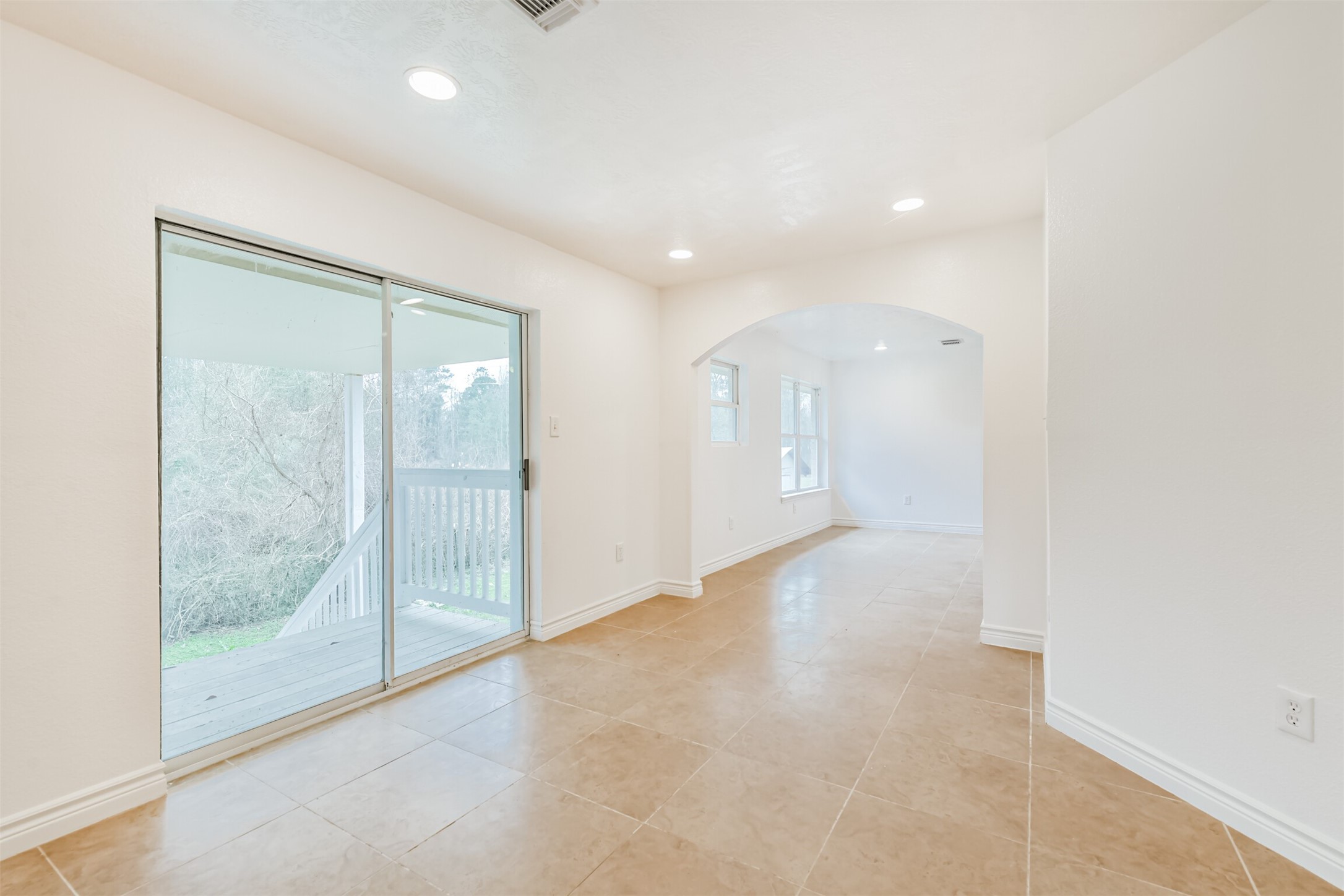 10412 Ehlers Road Conroe, TX 77302 - Photo 14 of 37 a view of an empty room with glass door