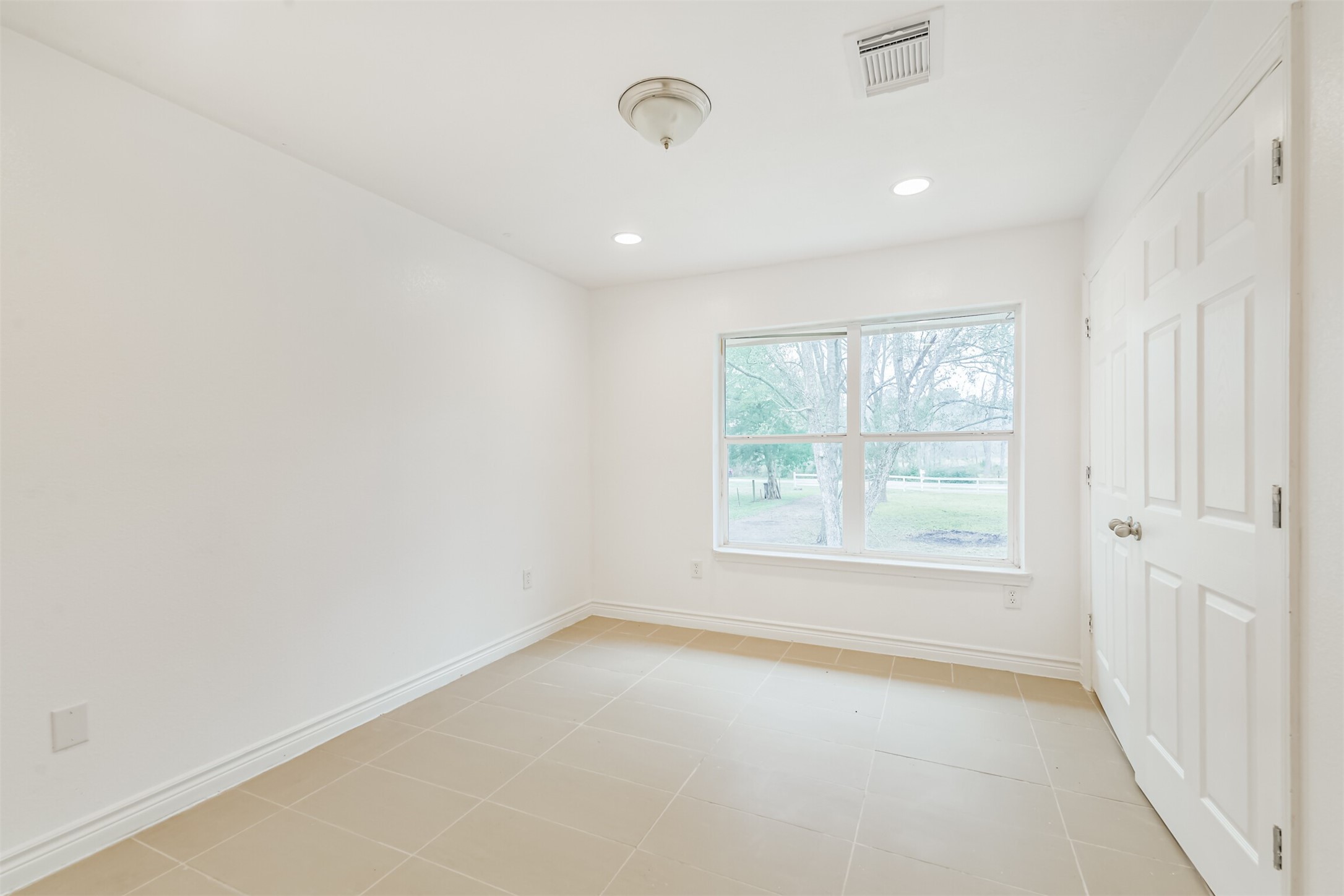 10412 Ehlers Road Conroe, TX 77302 - Photo 24 of 37 an empty room with a window