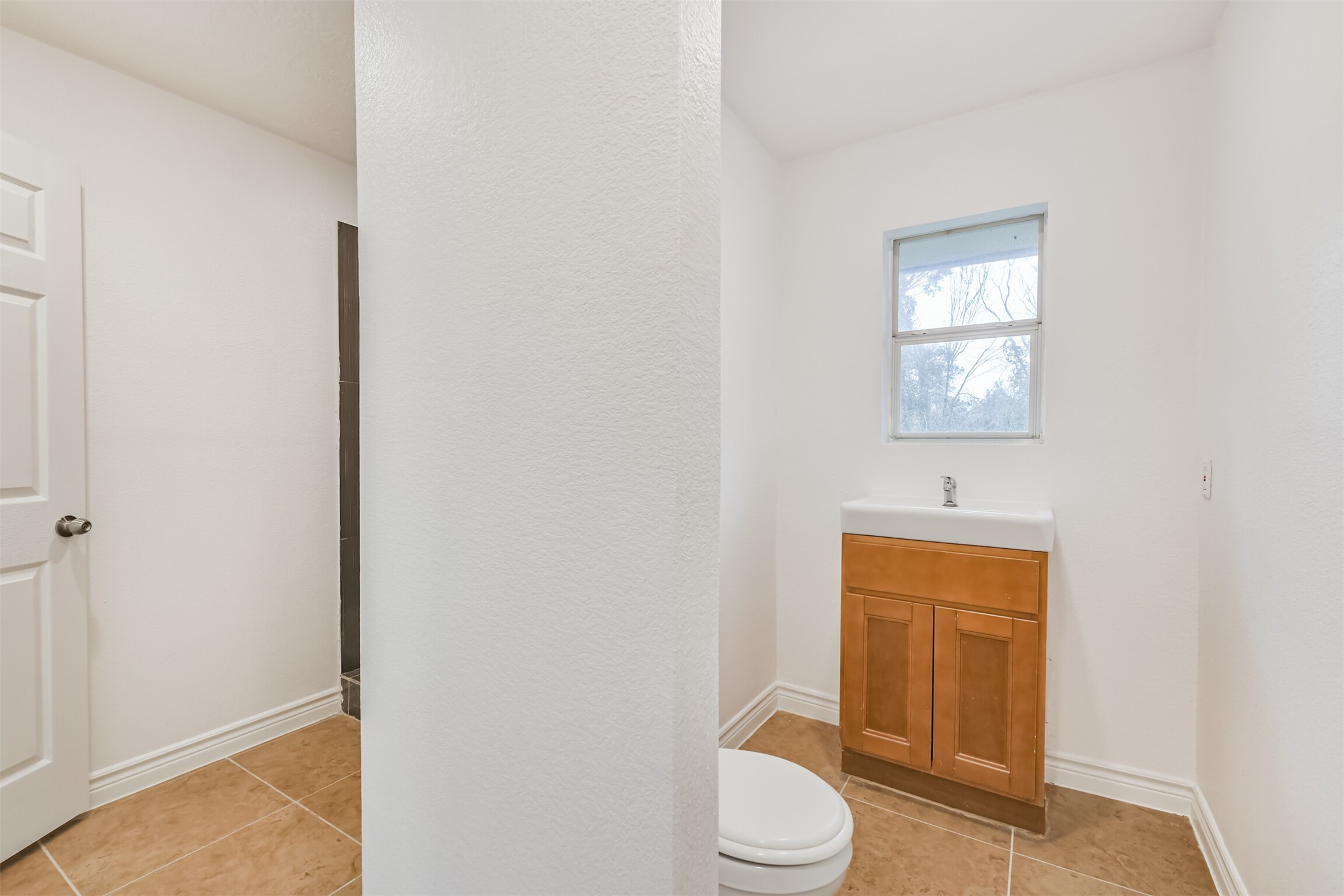 10412 Ehlers Road Conroe, TX 77302 - Photo 28 of 37 a white toilet sitting next to a bathroom sink