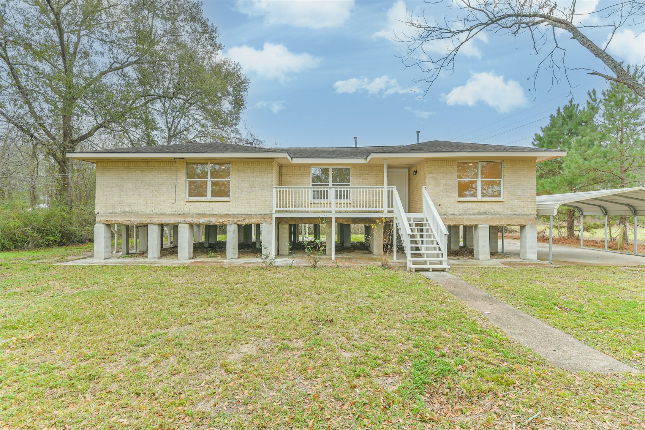 10412 Ehlers Road Conroe, TX 77302 - Photo 32 of 37 a front view of a house with a garden