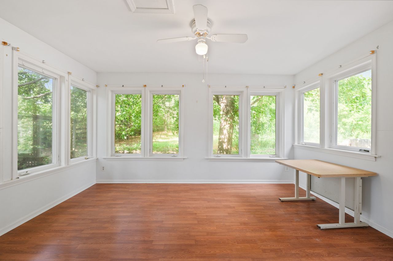 6 Crawling Stone Road Barrington Hills, IL 60010 - Photo 16 of 33 a view of an empty room with wooden floor and a window