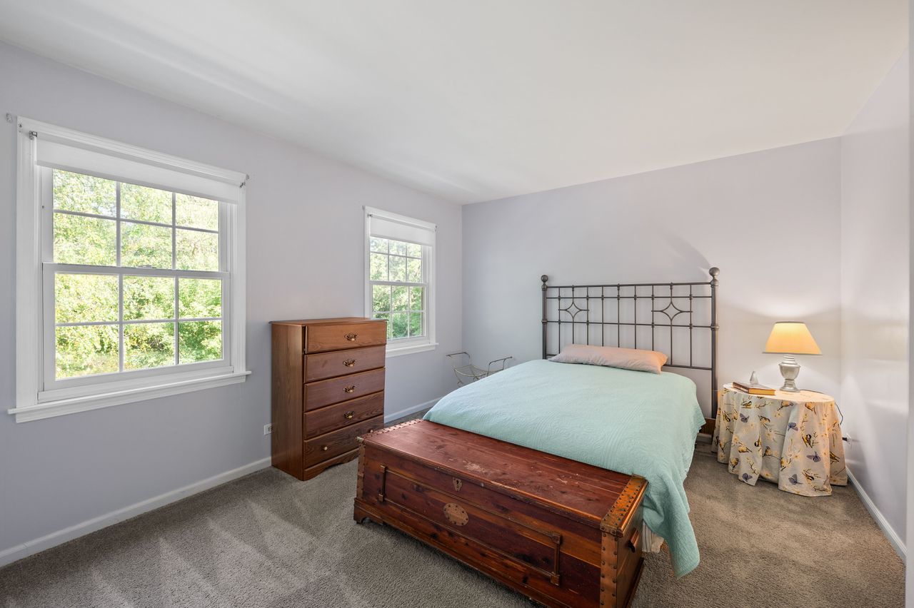 6 Crawling Stone Road Barrington Hills, IL 60010 - Photo 19 of 33 a bedroom with a bed and wooden floor