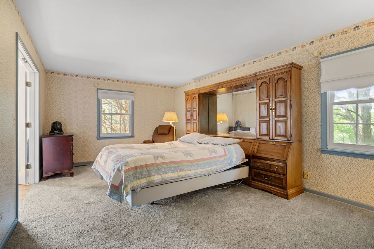 6 Crawling Stone Road Barrington Hills, IL 60010 - Photo 21 of 33 a bedroom with a bed and a large window