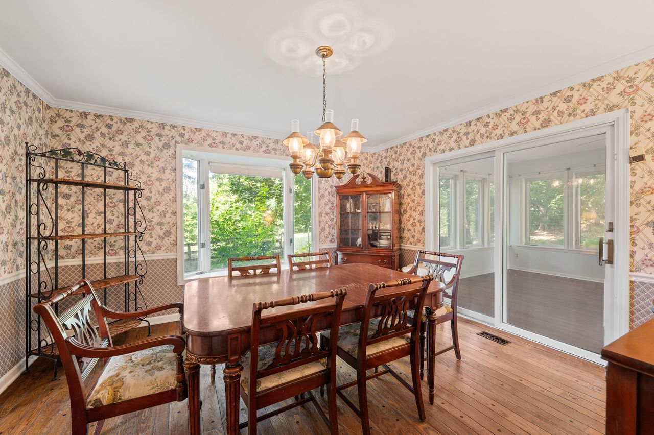 6 Crawling Stone Road Barrington Hills, IL 60010 - Photo 7 of 33 a dining room with furniture a chandelier and wooden floor